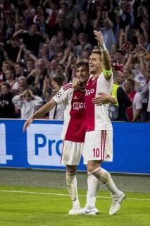 AMSTERDAM, AFC Ajax - AEK Athens FC, football, Champions League, season 2018-2019, 19-09-2018, Stadium Johan Cruijff Arena, Ajax player Nico Tagliafico (L) has scored 3-0, Ajax player Dusan Tadic (R) Ajax - AEK Athens  x2477034x