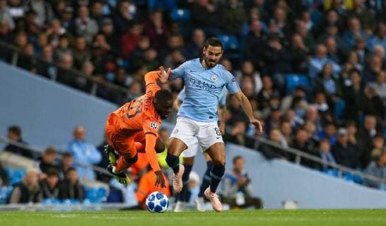 Ilkay GUNDOGON of Manchester City battles Tanguy NDOMBELE of Olympique Lyonnais during the UEFA Champions League match between Manchester City and Olympique Lyonnais at the Etihad Stadium, Manchester, England on 19 September 2018. Copyright: xDavidxHornx PMI-2241-0014