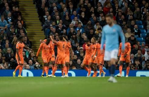 Manchester City v Olympique Lyonnais UEFA Champions League Lyon players celebrate after their ream go 1-0 up, as Bernardo Silva of Manchester City has a look of dejection in the foreground during the UEFA Champions League match at the Etihad Stadium, Manchester Content Not Available For UK Newspapers Copyright: xRussellxHartx FIL-12297-0012