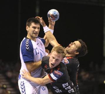 Photo Goal of Zagreb Ivan Srsen against the Flensburg Magnus Joendal and Rasmus Lauge Handball Men 1 Bundesliga on Wed 19 09 2018 Flensburg HC Zagreb