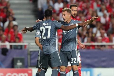 September 19, 2018 - Lisbon, Portugal - Bayern Munich s defender David Alaba from Austria and midfielder Joshua Kimmich from Germany celebrates a goal during the UEFA Champions League Group E football match SL Benfica vs Bayern Munich at the Luz stadium in Lisbon, Portugal on September 19, 2018. UEFA Champions League Group E football match SL Benfica vs Bayern Munich - ZUMAf123 20180919_zap_f123_001 Copyright: xPedroxFiuzax