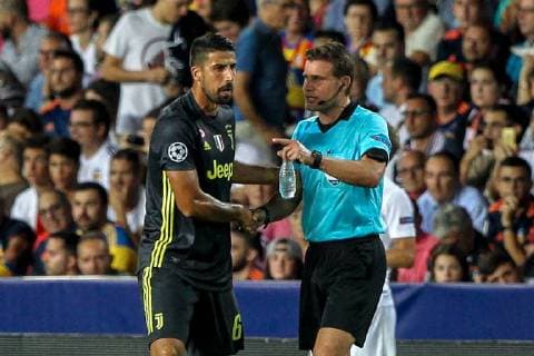 19th September 2018, Mestalla, Valencia, Spain; UEFA Champions League football, Valencia versus Juventus; Sami Khedira of Juventus Turin is injured shakes hands with the referee Felix Brych before to leaving the pitch  ActionPlus12063898 PedroxSalado