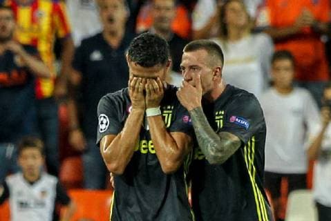 19th September 2018, Mestalla, Valencia, Spain; UEFA Champions League football, Valencia versus Juventus; Cristiano Ronaldo of Juventus Turin leaves the pitch after being shown a red card for a foul and sent off consoled by his team mate Federico Bernardeschi  ActionPlus12063907 PedroxSalado