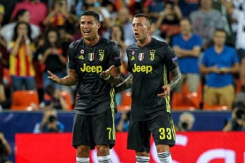 19th September 2018, Mestalla, Valencia, Spain; UEFA Champions League football, Valencia versus Juventus; Cristiano Ronaldo of Juventus Turin leaves the pitch after being shown a red card for a foul and sent off consoled by his team mate Federico Bernardeschi  ActionPlus12063908 PedroxSalado