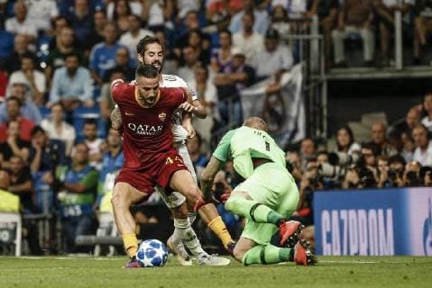 19th September 2018, Santiago Bernabeu, Madrid, Spain; UEFA Champions League football, Real Madrid versus AS Roma; Kostas Manolas (Roma) fights for control of the ball with Francisco Alarcon, ISCO (Real Madrid) as goalkeeper Olsen dives to save  ActionPlus12063942 ShotxforxPress