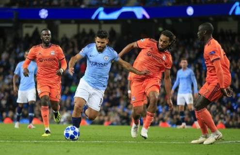 19th September 2018, Etihad Stadium, Manchester, England; UEFA Champions League football, Manchester City versus Lyon; Sergio Aguero of Manchester City holds off the challenge of Jason Denayer of Lyon  ActionPlus12063956 ConorxMolloy