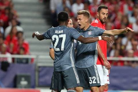 September 19, 2018 - Lisbon, Portugal - Bayern Munich s defender David Alaba from Austria and midfielder Joshua Kimmich from Germany celebrates a goal during the UEFA Champions League Group E football match SL Benfica vs Bayern Munich at the Luz stadium in Lisbon, Portugal on September 19, 2018. SL Benfica v FC Bayern Muenchen - UEFA Champions League  - ZUMAn230 20180919_zaa_n230_216 Copyright: xPedroxFiuzax