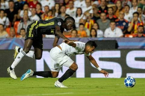 19th September 2018, Mestalla, Valencia, Spain; UEFA Champions League football, Valencia versus Juventus; Douglas Costa of Juventus Turin pressuring Gabriel of Valencia  ActionPlus12063979 PedroxSalado