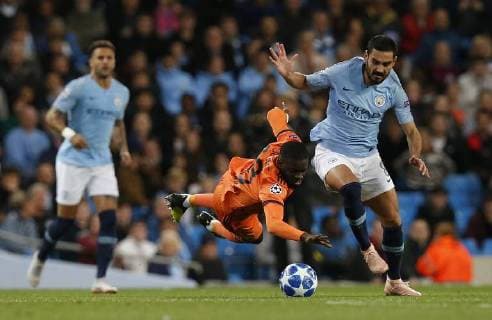 Manchester City s Ilkay Gundogan (R) battles for the ball with Lyon s Tanguy Ndombele during the UEFA Champions League Group F match at the Etihad Stadium, Manchester. Picture date 19th September 2018. Picture credit should read: Andrew Yates Sportimage EDITORIAL USE ONLY. No use with unauthorised audio, video, data, fixture lists, club league logos or live services. Online in-match use limited to 120 images, no video emulation. No use in betting, games or single club league player publications.