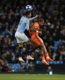 Manchester City s Aymeric Laporte (L) is challenged by Lyon s Memphis Depay during the UEFA Champions League Group F match at the Etihad Stadium, Manchester. Picture date 19th September 2018. Picture credit should read: Andrew Yates Sportimage EDITORIAL USE ONLY. No use with unauthorised audio, video, data, fixture lists, club league logos or live services. Online in-match use limited to 120 images, no video emulation. No use in betting, games or single club league player publications.