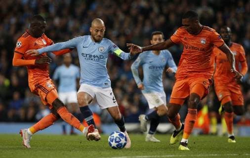 Manchester City s David Silva (C) is challenged by Lyon s Marcelo (R) during the UEFA Champions League Group F match at the Etihad Stadium, Manchester. Picture date 19th September 2018. Picture credit should read: Andrew Yates Sportimage EDITORIAL USE ONLY. No use with unauthorised audio, video, data, fixture lists, club league logos or live services. Online in-match use limited to 120 images, no video emulation. No use in betting, games or single club league player publications.