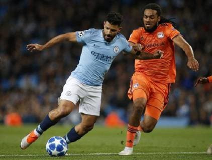 Manchester City s Sergio Aguero (L) is challenged by Lyon s Jason Denayer during the UEFA Champions League Group F match at the Etihad Stadium, Manchester. Picture date 19th September 2018. Picture credit should read: Andrew Yates Sportimage EDITORIAL USE ONLY. No use with unauthorised audio, video, data, fixture lists, club league logos or live services. Online in-match use limited to 120 images, no video emulation. No use in betting, games or single club league player publications.