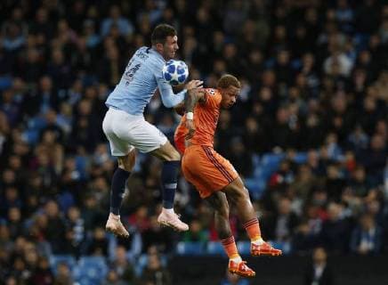 Lyon forward Memphis Depay challenged by Manchester City defender Aymeric Laporte during the UEFA Champions League Group F match at the Etihad Stadium, Manchester. Picture date 19th September 2018. Picture credit should read: Andrew Yates Sportimage EDITORIAL USE ONLY. No use with unauthorised audio, video, data, fixture lists, club league logos or live services. Online in-match use limited to 120 images, no video emulation. No use in betting, games or single club league player publications.