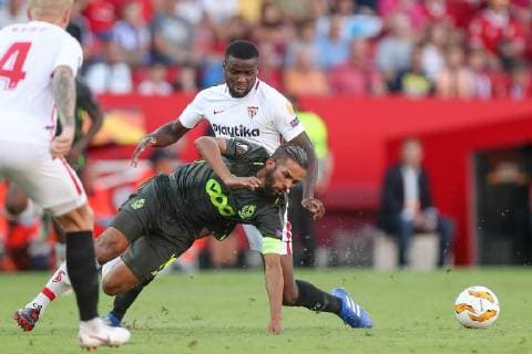 Standard s captain Mehdi Carcela and Sevilla s midfielder Ibrahim Amadou fight for the ball during a match between Belgian soccer team Standard de Liege and Spanish club Sevilla FC, Thursday 20 September 2018 in Sevilla, Spain, on day one of the UEFA Europa League group stage. BRUNOxFAHY  x05430075x