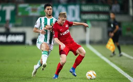 SOCCER - EL, Rapid vs Spartak VIENNA,AUSTRIA,20.SEP.18 - SOCCER - UEFA Europa League, group stage, SK Rapid Wien vs Spartak Moscow. Image shows Andrei Ivan (Rapid) and Nikolay Rasskazov (Spartak). GEPAxpictures xPhilippxBrem