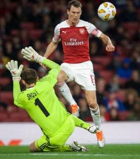 Stephan Lichtsteiner of Arsenal and Goalkeeper Bohdan Shust of Vorskla Poltava during the UEFA Europa League match group between Arsenal and Vorskla Poltava at the Emirates Stadium, London, England on 20 September 2018. Copyright: xAAx PMI-2243-0057