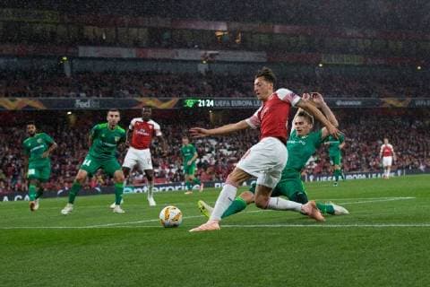 Mesut Ozil of Arsenal under pressure from Igor Perduta of Vorskla Poltava during the UEFA Europa League Group E match at the Emirates Stadium, London. Picture date 20th September 2018. Picture credit should read: Craig Mercer Sportimage EDITORIAL USE ONLY. No use with unauthorised audio, video, data, fixture lists, club league logos or live services. Online in-match use limited to 120 images, no video emulation. No use in betting, games or single club league player publications.