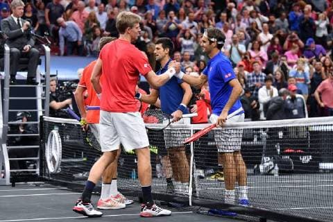 CHICAGO, IL - SEPTEMBER 21: Team World Jack Sock of the United States and Team World Kevin Anderson of South Africa shake hands with Team Europe Novak Djokovic of Serbia Team Europe Roger Federer of Switzerland after defeating them in their Men s Doubles match on day one of the 2018 Laver Cup at the United Center on September 21, 2018 in Chicago, Illinois. (Photo by Robin Alam Icon Sportswire) TENNIS: SEP 21 Laver Cup Icon164180921124 EDITORIAL USE ONLY