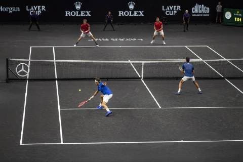 September 21, 2018 - Chicago, Illinois, U.S - Team Europe member ROGER FEDERER of Switzerland and partner NOVAK DJOKOVIC of Serbia take the net while Team World member KEVIN ANDERSON of South Africa and partner JACK SOCK of the United States stay back on the baseline during the first doubles match on Day One of the Laver Cup at the United Center in Chicago, Illinois. Laver Cup Day 1 - ZUMAl140 20180921_zap_l140_153 Copyright: xShelleyxLiptonx