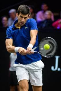 CHICAGO, IL - SEPTEMBER 22: Team Europe s Novak Djokovic of Serbia returns a ball to Team World s Kevin Anderson of South Africa during a singles match on day two of the 2018 Laver Cup on September 22, 2018, at the United Center in Chicago, Illinois. Anderson beats Djokovic 7-6(5) 5-7 10-6 . (Photo by Daniel Bartel Icon Sportswire) TENNIS: SEP 22 Laver Cup Icon180922048 EDITORIAL USE ONLY