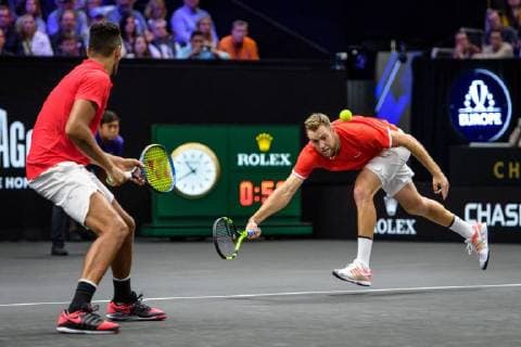 CHICAGO, IL - SEPTEMBER 22: Team World s Jack Sock of the United States of America reaches for a ball hit between him and Team World s Nick Kyrgios of Australia during a doubles match on day two of the 2018 Laver Cup on September 22, 2018, at the United Center in Chicago, Illinois. Sock & Kyrgios beat Goffin & Dimitrov 6-3 6-4. (Photo by Daniel Bartel Icon Sportswire) TENNIS: SEP 22 Laver Cup Icon180922072 EDITORIAL USE ONLY