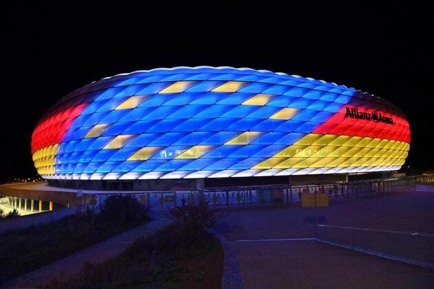 Special illumination of the ALLIANZ ARENA FC Bayern Muenchen and the Bundesliga support the bid to host the UEFA EURO 2024 Football Arena Football Stadium FC Bayern Muenchen Night shot Evening sky Night sky illuminated Light Mood Evening mood Overview Total architecture