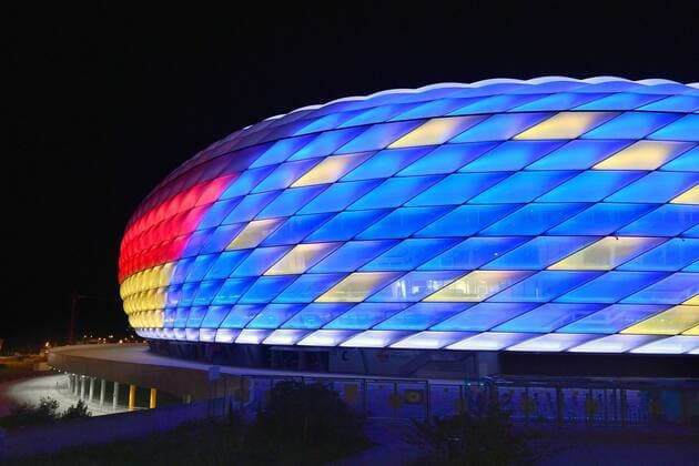 Special illumination of the ALLIANZ ARENA FC Bayern Muenchen and the Bundesliga support the bid to host the UEFA EURO 2024 Football Arena Football Stadium FC Bayern Muenchen Night shot Evening sky Night sky illuminated Light Mood Evening mood Overview Total architecture