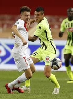 (180926) -- FONTVIEILLE, Sept. 26, 2018 (Xinhua) -- Pierrick Capelle (R) of Angers vies with Aleksandr Golovin of Monaco during the French Ligue 1 seventh round match between Angers and Monaco in Fontvieille, Monaco on Sept. 25, 2018. Angers won 1-0. (Xinhua Marco Fino) (SP)MONACO-FONTVIEILLE-FOOTBALL-LIGUE 1-ANGERS VS MONACO 