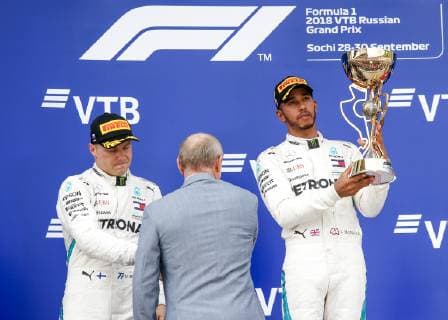 Motorsports: FIA Formula One World Championship WM Weltmeisterschaft 2018, Grand Prix of Russia, 44 Lewis Hamilton (GBR, Mercedes AMG Petronas F1 Team), 77 Valtteri Bottas (FIN, Mercedes AMG Petronas), Vladimir Putin, President of Russia on the podium Sochi Russia