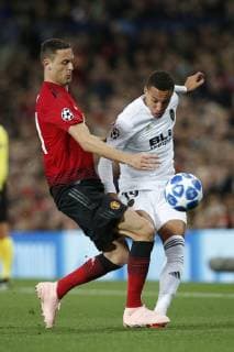 Nemanja Matic of Manchester United ManU tackles Rodrigo of Valencia during the UEFA Champions League Group H match at Old Trafford Stadium, Manchester. Picture date: 2nd September 2018. Picture credit should read: Andrew Yates Sportimage EDITORIAL USE ONLY. No use with unauthorised audio, video, data, fixture lists, club league logos or live services. Online in-match use limited to 120 images, no video emulation. No use in betting, games or single club league player publications.