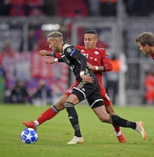 02 10 2018 Football UEFA Champions League 2018 2019 Group Stage 2 Gameday FC Bayern Munich Ajax Amsterdam at Allianz Arena Munich left Hakim Ziyche Ajax Amsterdam v Thiago Bayern Munich DFL and DFB regulations prohibit any use of images as image sequences and or almost video