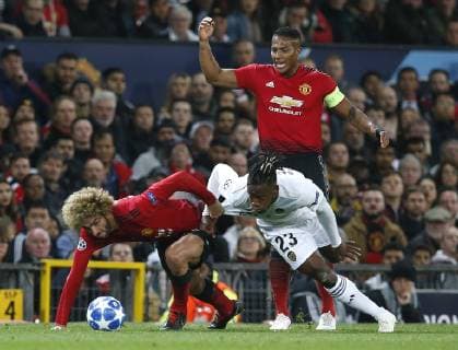 Mauroane Fellaini of Manchester United ManU tackles Michy Batshuayi of Valencia during the UEFA Champions League Group H match at Old Trafford Stadium, Manchester. Picture date: 2nd September 2018. Picture credit should read: Andrew Yates Sportimage EDITORIAL USE ONLY. No use with unauthorised audio, video, data, fixture lists, club league logos or live services. Online in-match use limited to 120 images, no video emulation. No use in betting, games or single club league player publications.