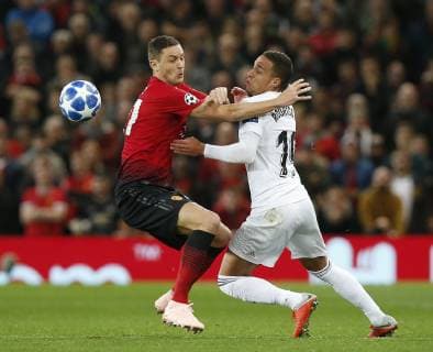 Nemanja Matic of Manchester United ManU tackled by Rodrigo of Valencia during the UEFA Champions League Group H match at Old Trafford Stadium, Manchester. Picture date: 2nd September 2018. Picture credit should read: Andrew Yates Sportimage EDITORIAL USE ONLY. No use with unauthorised audio, video, data, fixture lists, club league logos or live services. Online in-match use limited to 120 images, no video emulation. No use in betting, games or single club league player publications.