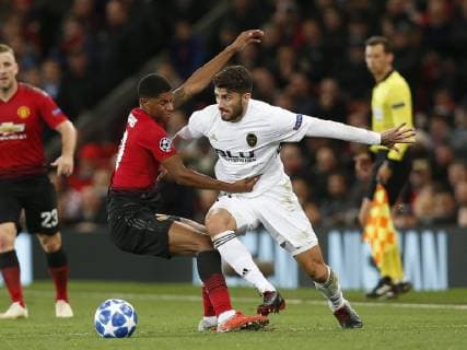 Cristiano Piccini of Valencia clatters into Markus Rashford of Manchester United ManU during the UEFA Champions League Group H match at Old Trafford Stadium, Manchester. Picture date: 2nd September 2018. Picture credit should read: Andrew Yates Sportimage EDITORIAL USE ONLY. No use with unauthorised audio, video, data, fixture lists, club league logos or live services. Online in-match use limited to 120 images, no video emulation. No use in betting, games or single club league player publications.