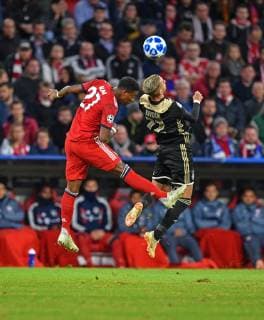 SOCCER - UEFA CL, Bayern vs Ajax MUNICH,GERMANY,02.OCT.18 - SOCCER - UEFA Champions League, FC Bayern Muenchen vs AFC Ajax Amsterdam. Image shows David Alaba (Bayern) and Hakim Ziyech (Ajax). GEPAxpictures xHansxOsterauer