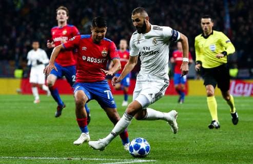 MOSCOW, RUSSIA - OCTOBER 2, 2018: CSKA Moscow s Ilzat Akhmetov (L) and Real Madrid s Karim Benzema fight for the ball in their 2018 19 UEFA Champions League Group G Round 2 football match at Luzhniki Stadium. Anton Novoderezhkin TASS  TS0923C7