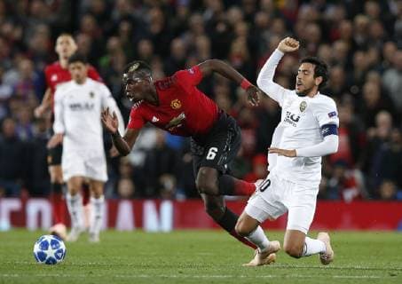 Paul Pogba of Manchester United ManU tackled by Daniel Parejo of Valencia during the UEFA Champions League Group H match at Old Trafford Stadium, Manchester. Picture date: 2nd September 2018. Picture credit should read: Andrew Yates Sportimage EDITORIAL USE ONLY. No use with unauthorised audio, video, data, fixture lists, club league logos or live services. Online in-match use limited to 120 images, no video emulation. No use in betting, games or single club league player publications.