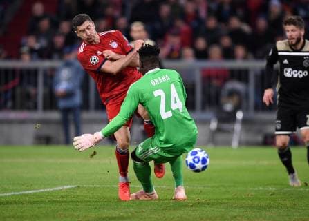FOOTBALL CHAMPIONS LEAGUE SEASON 2018 2019 GROUP PHASE FC Bayern Muenchen Ajax Amsterdam 02 10 2018 Robert Lewandowski behind FC Bayern Muenchen against goalkeeper Andre Onana Ajax Amsterdam