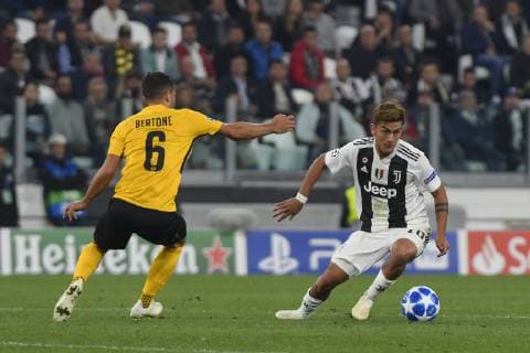 2nd October 2018, Allianz Stadium, Turin, Italy; UEFA Champions League football, Juventus versus Young Boys; Paulo Dybala of Juventus turns inside the challenge from Leonardo Bertone of the Young Boys  ActionPlus12067366 PierpaoloxPiciucco