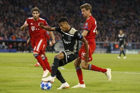 (l-r) Javi Martinez of FC Bayern Munchen, David Neres of Ajax, Thomas Muller of FC Bayern Munchen during the UEFA Champions League group E match between Bayern Munich and Ajax Amsterdam at the Allianz Arena on October 02, 2018 in Munich, Germany UEFA Champions League 2018 2019 xVIxVIxImagesx xTomxBodexMultimediaxIVx 12325528