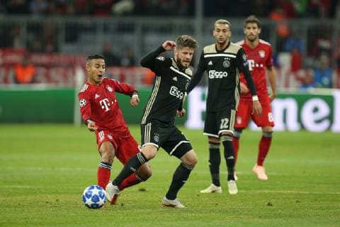 in action with Thiago Alcantara 6 FC Bayern Muenchen and Lasse Schoene 20 Ajax Amsterdam FC Bayern Munich vs Ajax Amsterdam Football Preliminary Round Champions League 02 10 2018 Muenchen Bayern Germany Copyright: xkolbert-press ChristianxKolbertx