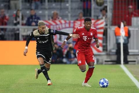 In action with Hakim Ziyech 22 Ajax Amsterdam and David Alaba 27 FC Bayern Muenchen FC Bayern Munich vs Ajax Amsterdam Football Preliminary Round Champions League 02 10 2018 Muenchen Bayern Germany Copyright: xkolbert-press ChristianxKolbertx