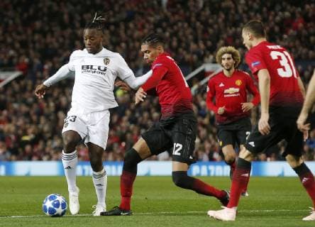 Michy Batshuayi of Valencia tackled by Chris Smalling of Manchester United ManU during the UEFA Champions League Group H match at Old Trafford Stadium, Manchester. Picture date: 2nd September 2018. Picture credit should read: Andrew Yates Sportimage EDITORIAL USE ONLY. No use with unauthorised audio, video, data, fixture lists, club league logos or live services. Online in-match use limited to 120 images, no video emulation. No use in betting, games or single club league player publications.