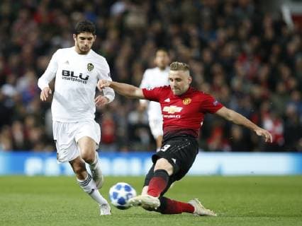 Goncalo Guedes of Valencia tackled by Luke Shaw of Manchester United ManU during the UEFA Champions League Group H match at Old Trafford Stadium, Manchester. Picture date: 2nd September 2018. Picture credit should read: Andrew Yates Sportimage EDITORIAL USE ONLY. No use with unauthorised audio, video, data, fixture lists, club league logos or live services. Online in-match use limited to 120 images, no video emulation. No use in betting, games or single club league player publications.
