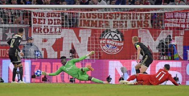 02 10 2018 Football UEFA Champions League 2018 2019 Group Stage 2 Gameday FC Bayern Munich Ajax Amsterdam in the Allianz Arena Munich Goalkeeper Andre Onana left Ajax Amsterdam scored the shot on goal by James Rodriguez re Bayern Munich DFL and DFB regulations prohibit any use of photographs as image sequences and or quasi video