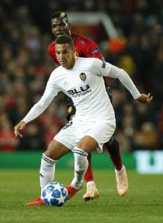 Rodrigo of Valencia gets clear of Paul Pogba of Manchester United ManU during the UEFA Champions League Group H match at Old Trafford Stadium, Manchester. Picture date: 2nd September 2018. Picture credit should read: Andrew Yates Sportimage EDITORIAL USE ONLY. No use with unauthorised audio, video, data, fixture lists, club league logos or live services. Online in-match use limited to 120 images, no video emulation. No use in betting, games or single club league player publications.