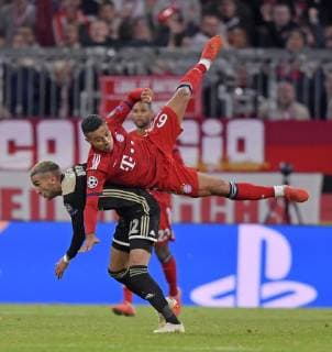 02 10 2018 Football UEFA Champions League 2018 2019 Group Stage 2 Gameday FC Bayern Munich Ajax Amsterdam at Allianz Arena Munich left Hakim Ziyche Ajax Amsterdam v Thiago Bayern Munich DFL and DFB regulations prohibit any use of images as image sequences and or almost video
