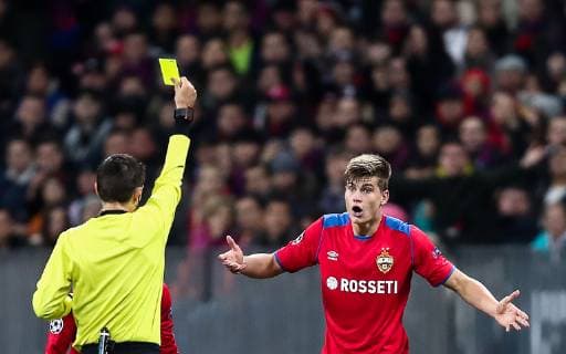 MOSCOW, RUSSIA - OCTOBER 2, 2018: Referee Ovidiu Hategan (L) shows the yellow card to CSKA Moscow s Jaka Bijol in the 2018 19 UEFA Champions League Group G Round 2 football match against Real Madrid at Luzhniki Stadium. Valery Sharifulin TASS  TS0923EB
