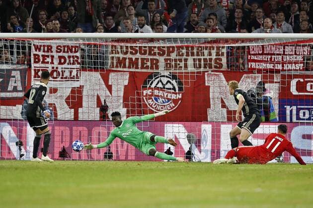 MUNCHEN, 02-10-2018, Allianz Arena, season 2018 2019, Champions League football. Ajax midfielder Noussair Mazraoui (L) and Ajax goalkeeper Andre Onana (C) Bayern Munchen player James Rodriguez (R) during the game Bayern Munchen - Ajax (1-1). Bayern Munchen - Ajax  x2516341x
