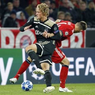 MUNCHEN, 02-10-2018, Allianz Arena, season 2018 2019, Champions League football. Ajax forwarder Kasper Dolberg (L) on the ball during the game Bayern Munchen - Ajax (1-1). Bayern Munchen - Ajax  x2516368x